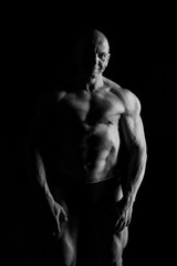 Obraz na płótnie Canvas bodybuilder, bodybuilding, sports, background, black, studio, bl
