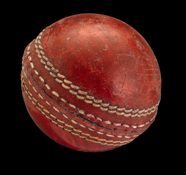 Old worn Cricket Ball isolated on Black Background