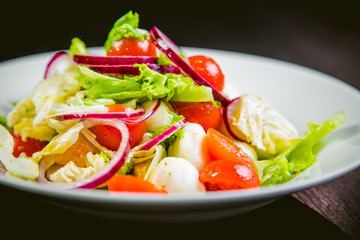delicious vegetarian salad, salad with fruits and vegetables