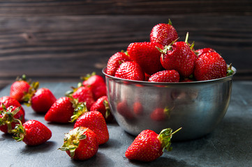 Fresh strawberries on old wooden background