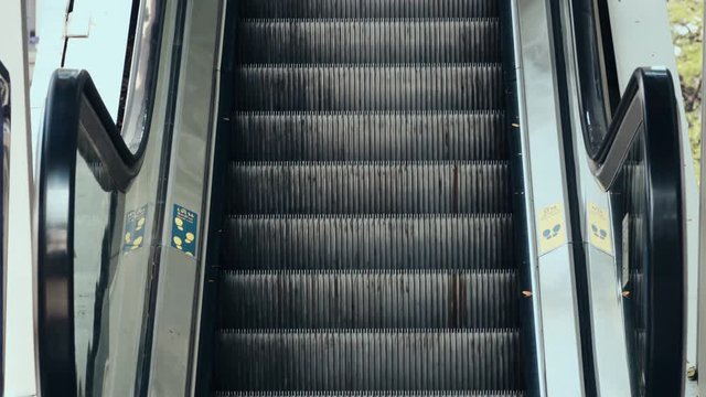 moving escalator at the train station. 4K Stock Footage Clip.
