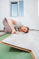 Obraz na płótnie Canvas Installing laminate flooring