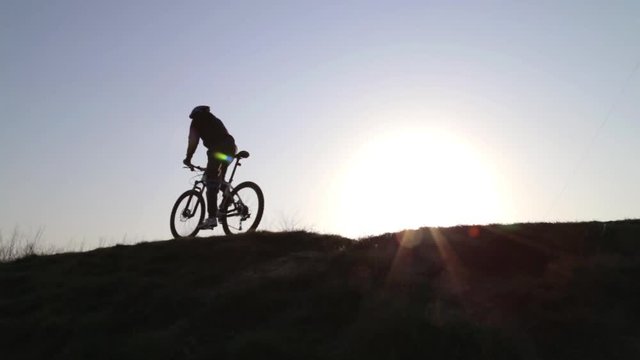 Man at Sunset on a Bicycle