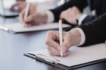 Business people making notes