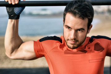 Fototapeta premium Athlete practicing exercises of calisthenics