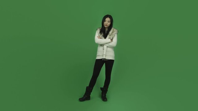 Asian girl young adult isolated greenscreen green background upset anger