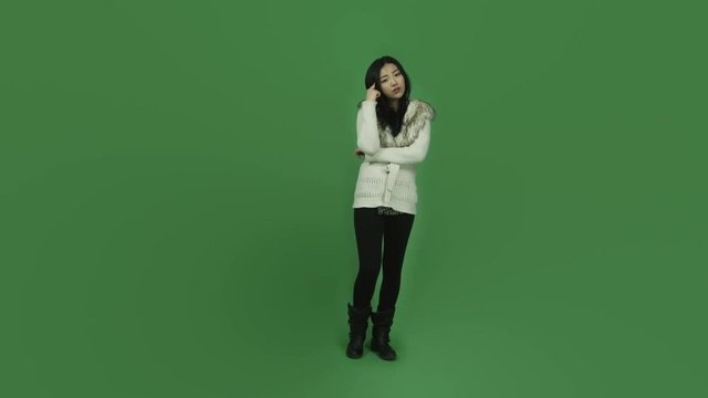 Asian girl young adult isolated greenscreen green background thinking scratching head