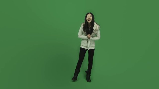 Asian girl young adult isolated greenscreen green background laughing