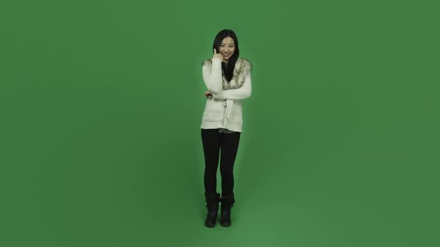 Asian girl young adult isolated greenscreen green background with call me sign