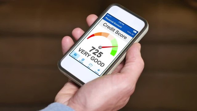 A man checks his FICO credit score on his smartphone. The result is very good. Fictional device and screen interface.	