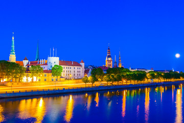 Fototapeta na wymiar Old Town of Riga with reflection in Daugava River at night, Riga