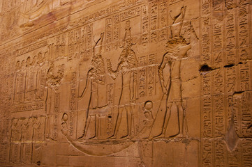 Fototapeta na wymiar Egypt reliefs on walls in ancient temples