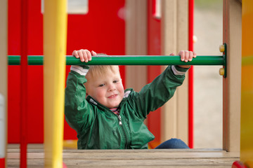 Fototapeta premium children play on the playground. early spring