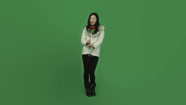 Asian girl young adult isolated greenscreen green background romance with roses