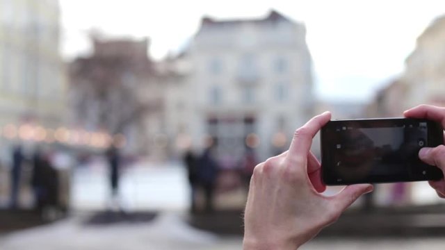 The man is photographed on a smartphone