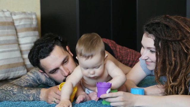 Young Family Plays With His Son In A Pyramid