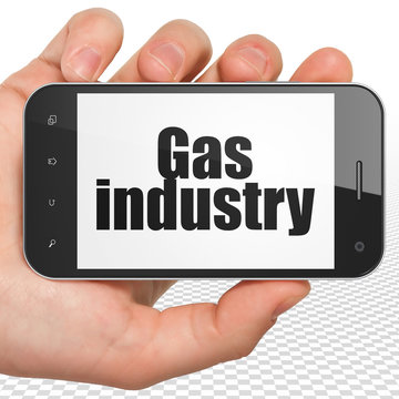 Manufacuring concept: Hand Holding Smartphone with Gas Industry on display