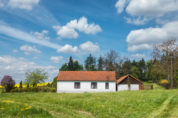 Spring countryside with beautiful old country house