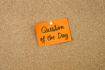 QUESTION OF THE DAY written on orange paper note