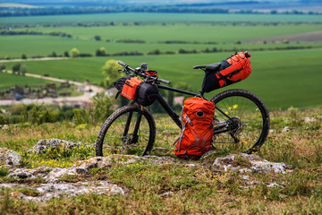 Bicycle with orange bags for travel