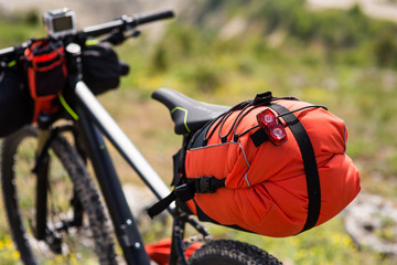 Bicycle with orange bags for travel