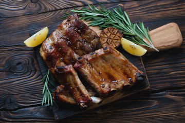 Freshly baked pork ribs in a rustic wooden setting