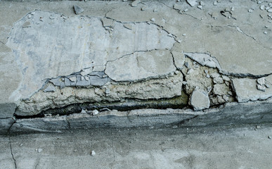 Fototapeta premium Old vintage crack wall / black and white cracked floor texture / cracked wall or road / cracked concrete wall for background / Grunge concrete cement wall with crack in industrial building