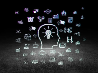 Business concept: Head With Lightbulb in grunge dark room