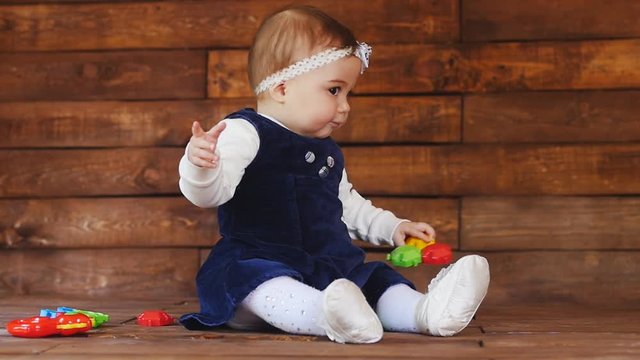 Little girl playing with color toys
