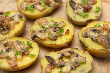 baked potato with mushrooms and bacon with cheese.