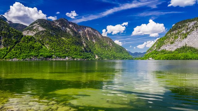 Mountain Lake in Hallstatt and clouds on a sunny day, 4k timelapse