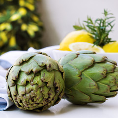 Fototapeta premium Organic fresh artichokes with lemon