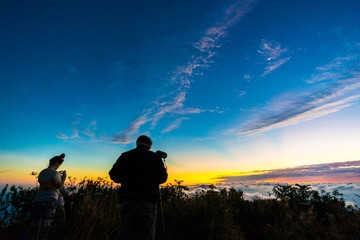 Fototapeta premium Group of tourism enjoying sunrise on top of mountain