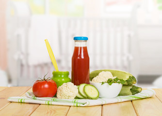 Bottle of tomato juice and vegetable puree bank  onbackground kitchen.