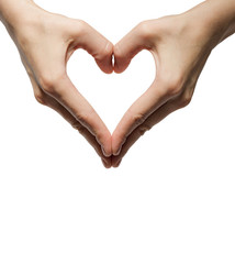 girl's hands serried in a heart shape on isolated background