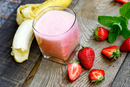  Banana - strawberry smoothie in glass (healthy vegetarian drink)