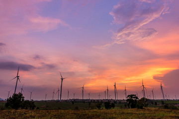 Obraz premium Wind turbine power generator at twilight