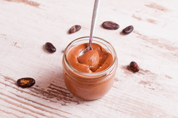 chocolate paste in a glass jar closeup