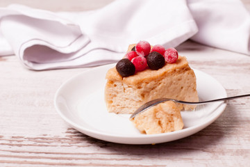 tasty piece of cake with berries in saucer
