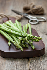 fresh asparagus on a cutting board