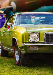 Green vintage car. Classic retro car. Close-up of an old green retro car. Vintage retro car....