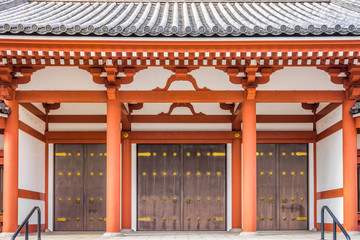 The door entrance of Buddhist pagoda at Senso-ji Temple in Tokyo. The construction is shown the ancient structure of Japanese Buddhism. © joeyphoto