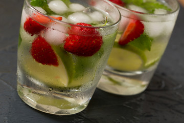 Refreshing summer cocktail with lime, strawberry and mint. Mojit