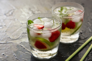 Refreshing summer cocktail with lime, strawberry and mint. Mojit