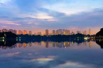 Reflection of building in the lake at sunrise at lakeside. Singa