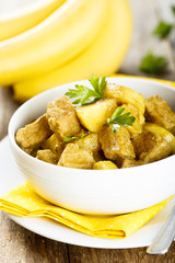 Meat curry with potatoes and banana