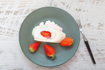 Homemade cake roll with strawberry cream