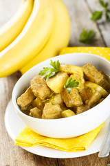 Meat curry with potatoes and banana