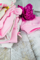 Pink layette for a newborn baby girl with peone