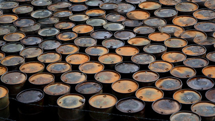 Stacks of old oil tanks making a background